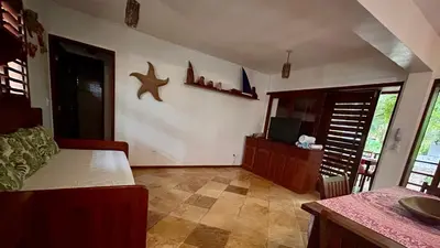 Uma televisão e/ou sistema de entretenimento em Casas MyM BOUGANVILLE 1 e 2