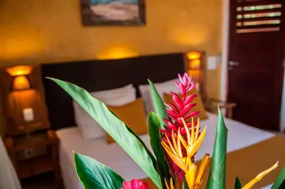 Uma cama ou camas num quarto em Duro Beach Hotel