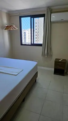 Uma cama ou camas num quarto em Ed. Porto de Iracema 630