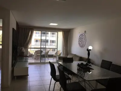 Uma área de estar em Terramaris Apartamento