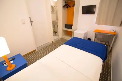Uma cama ou camas num quarto em Hotel Villa Smart