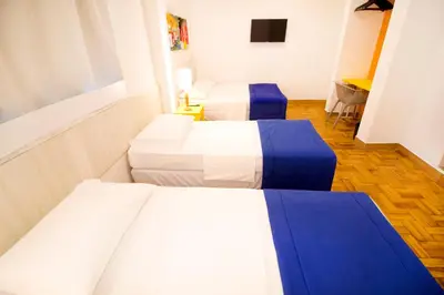 Uma cama ou camas num quarto em Hotel Villa Smart