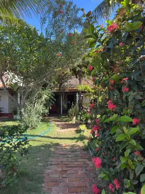 Um jardim no exterior de Pousada Casa do Josef