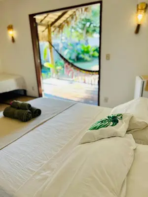 Uma cama ou camas num quarto em Pousada kaz'oca