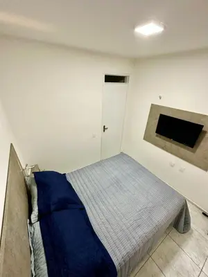 Uma cama ou camas num quarto em Fortal Flat