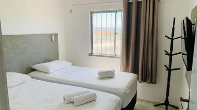Uma cama ou camas num quarto em Fortal Flat