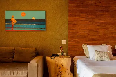 Uma cama ou camas num quarto em Carmel Charme Resort
