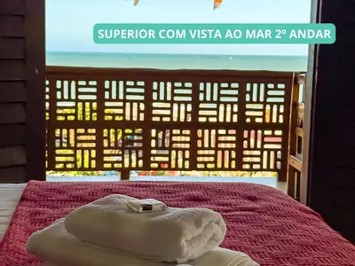 Uma cama ou camas num quarto em Pousada Sunrise Beach Cumbuco