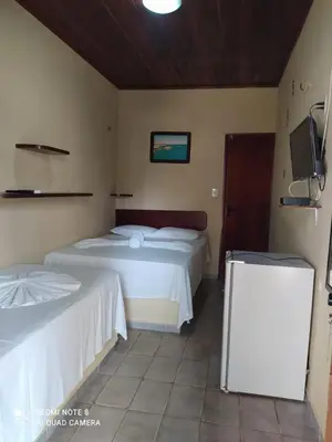 Uma cama ou camas num quarto em Pousada Via Lactea
