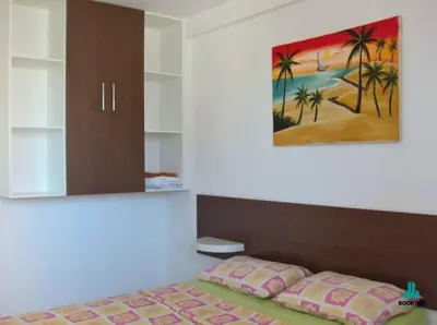 Uma cama ou camas num quarto em Brisa do Mar Apartments
