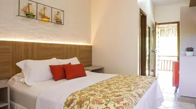 Uma cama ou camas num quarto em Kanaloa Pousada
