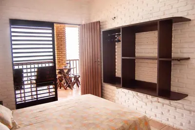 Uma cama ou camas num quarto em Casa triplex Lagoinha