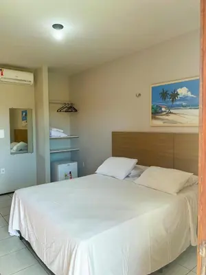 Uma cama ou camas num quarto em Pousada Missare
