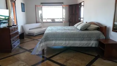 Uma cama ou camas num quarto em Pousada Vale do Luar