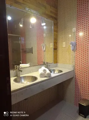 Uma casa de banho em Pousada Presidente Hotel