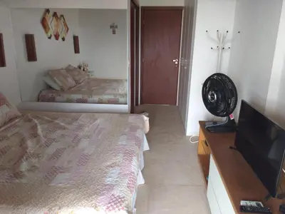 Uma cama ou camas num quarto em Apartamento Taíba Beach Resort