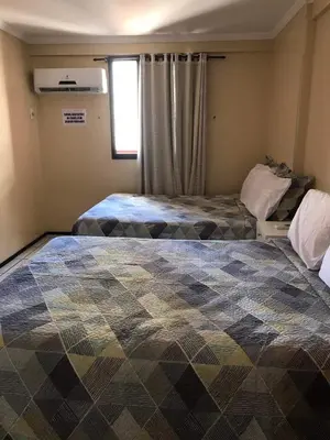 Uma cama ou camas num quarto em Porto de Iracema