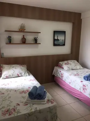 Uma cama ou camas num quarto em Apartamento no Condomínio Mediterranee