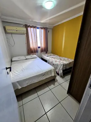 Uma cama ou camas num quarto em Porto de Iracema - 611 Frente mar