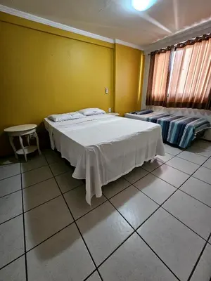Uma cama ou camas num quarto em Porto de Iracema - 611 Frente mar
