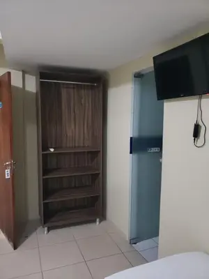 Uma televisão e/ou sistema de entretenimento em Pousada Dragao Do Mar