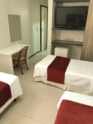 Uma cama ou camas num quarto em Aldeota Praia Hotel