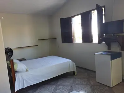 Uma cama ou camas num quarto em Pousada Aconchego