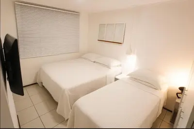 Uma cama ou camas num quarto em Atlantic Ocean Residence