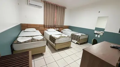 Uma cama ou camas num quarto em Abrolhos Praia Hotel