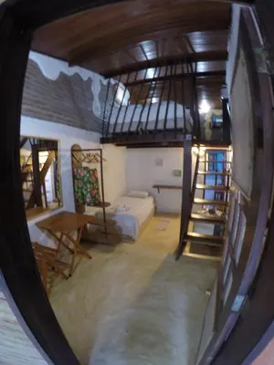 Uma cama ou camas num quarto em Pousada Ibirapuera