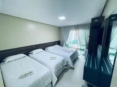 Uma cama ou camas num quarto em Star Hotel