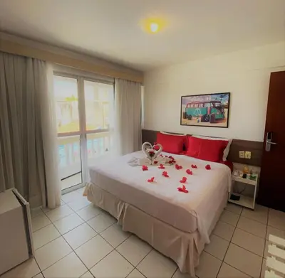 Uma cama ou camas num quarto em Algarve Praia Hotel