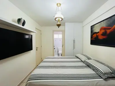 Uma cama ou camas num quarto em Cond. Beach Village Residence 1