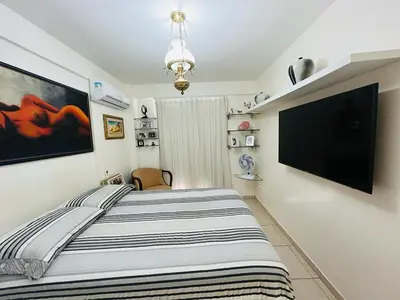 Uma cama ou camas num quarto em Cond. Beach Village Residence 1