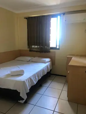 Uma cama ou camas num quarto em Porto de Iracema Residence
