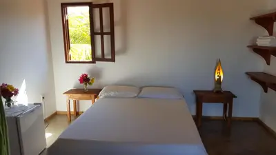 Uma cama ou camas num quarto em Pousada Agua Marinha