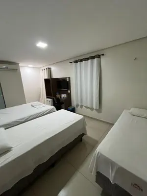 Uma cama ou camas num quarto em Seller Hotel