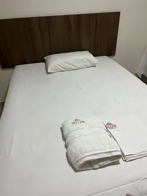 Uma cama ou camas num quarto em Seller Hotel