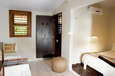 Uma cama ou camas num quarto em Pousada Por do Sol