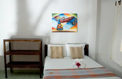 Uma cama ou camas num quarto em Pousada Por do Sol