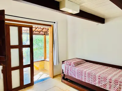 Uma cama ou camas num quarto em Pousada e Restaurante do Paulo