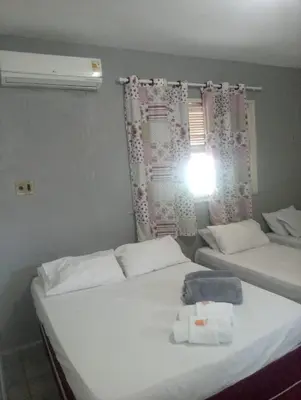 Uma cama ou camas num quarto em Pousada Atlantico Centro - Fortaleza