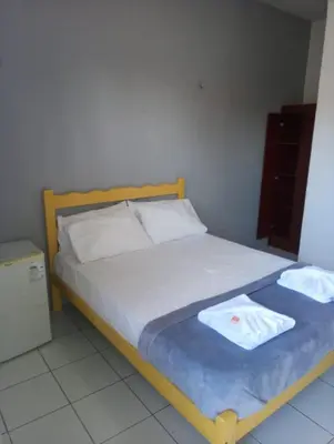 Uma cama ou camas num quarto em Pousada Atlantico Centro - Fortaleza