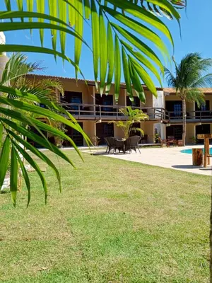 Um jardim no exterior de Hotel Pousada Cumbuco Gold