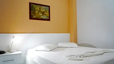 Uma cama ou camas num quarto em Hotel Americas