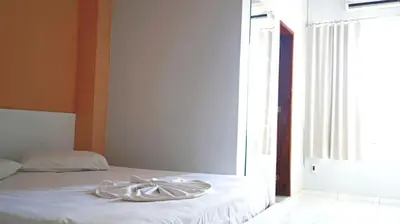 Uma cama ou camas num quarto em Hotel Americas