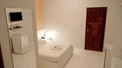 Uma cama ou camas num quarto em Hotel Americas