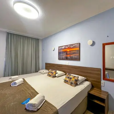 Uma cama ou camas num quarto em Jangadeiro Praia Hotel Resort - Parque Aquático e Pé na Areia