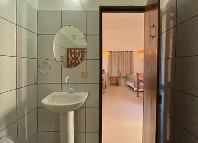 Uma cama ou camas num quarto em Pousada da Renata