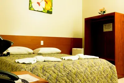 Uma cama ou camas num quarto em Hotel Poyares